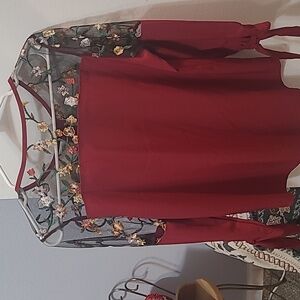 Maroon colored satin blouse with sheer embroidered sleeves. Size-M (7-9)